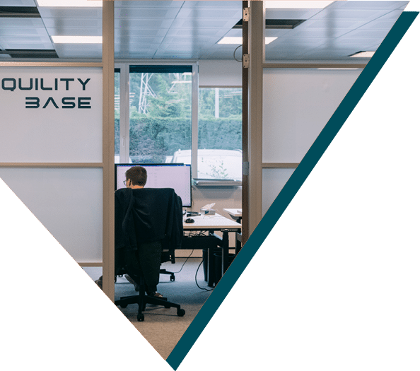 Sirus member at their desk in the Tranquality Base section of the Sirus office.