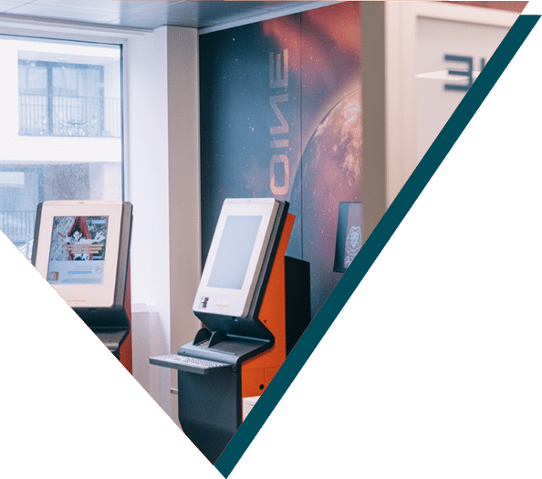 Display kiosks in the Sirus office with futuristic galaxy-themed walls.