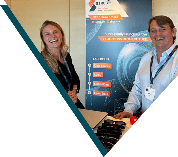 Two Sirus employees smiling at a smart city conference, standing at a booth showcasing Sirus' expertise in data spaces, LDES, linked data, and open data solutions, aimed at optimizing urban management and IT infrastructure for smart cities.