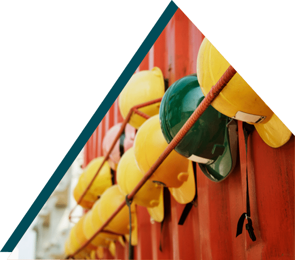 A line-up of hard hats at a construction site