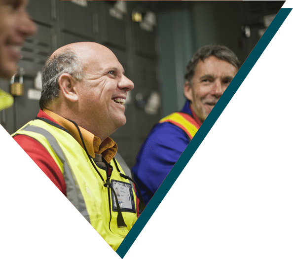 Construction workers are conversing and laughing