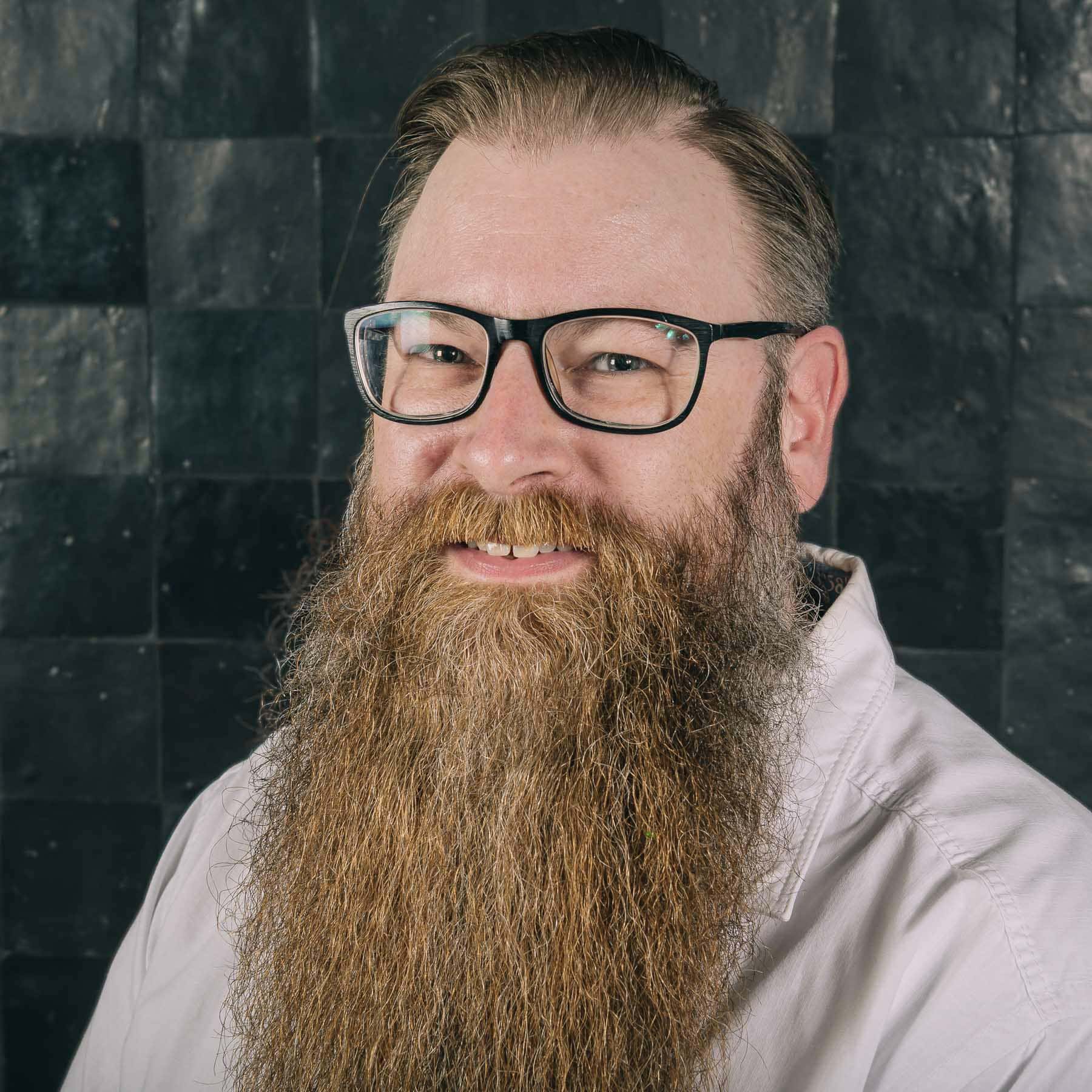 Professional headshot of Kevin Stockmans, .NET Developer at Sirus, smiling man with glasses and long beard